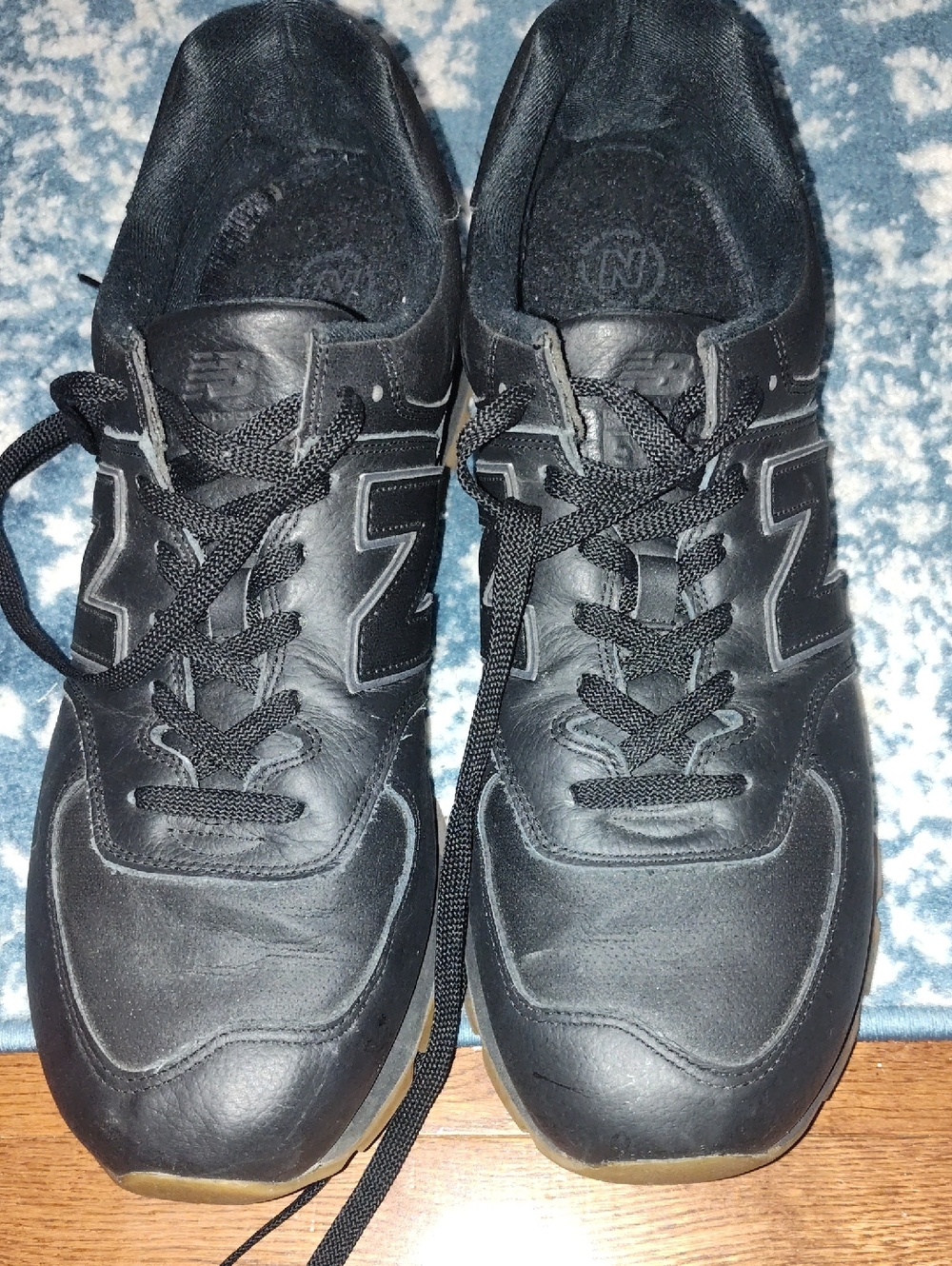 New Balance Men’s Black Leather Sneakers with Subtle Gum Sole